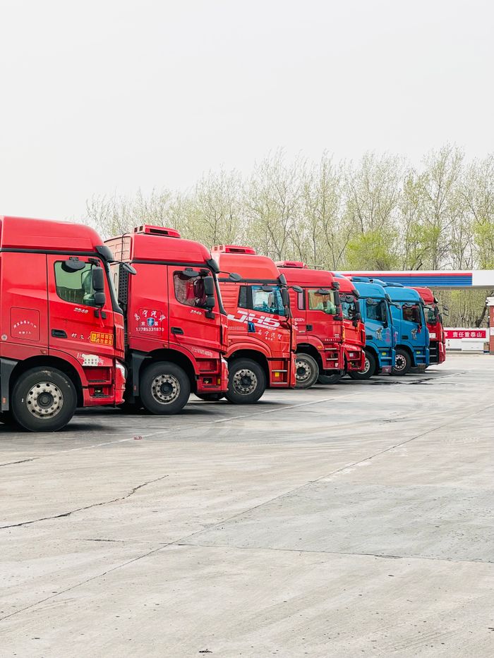 Mastering the First Impression: Your intriguing post title goes here A row of vibrant trucks parked at a transportation depot in Tianjin, China.