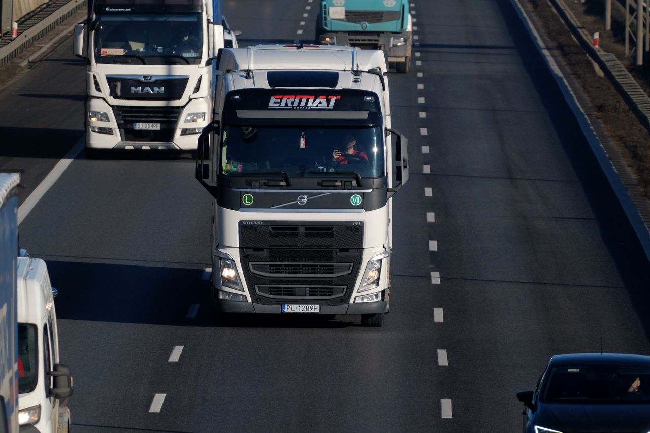 mission-02 Heavy duty trucks driving on a highway, showcasing transportation and logistics.
